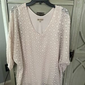 Cream, sheer tunic, has tassels on it. Excellent condition. Size large.